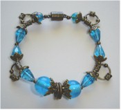 Cerulean blue crystals and antique bronze bracelet.