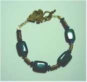 Green Chrysocolla with antique bronze bracelet.