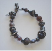 Agate, pewter, pearls, lava and gunmetal bracelet.