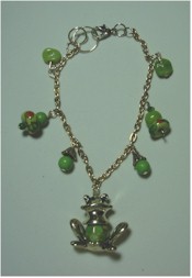 Silver frog and green flower charms bracelet.