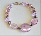 Pink Crystals, Dichroic glass, and Silver bracelet.