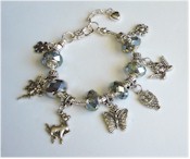 Silver charm bracelet with translucent crystal beads.