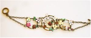 Ladybugs and flowers on link chain bracelet.