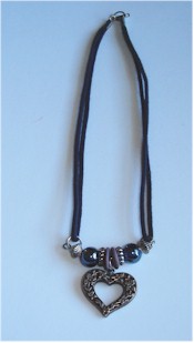 Double sided metal flower heart and beads necklace.