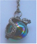 Pewter serpent coils around iridescent globe necklace.