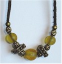 Frosty golden translucent beads and antique brass on suede necklace.