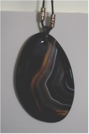 Onyx Agate slice pendant on leather cord.