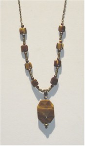 Tiger Eye Pendant and beads on bronze chain.