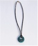 Chrysocolla pendant on black suede cord.