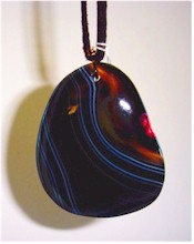 Onyx Agate slice pendant on suede cord.