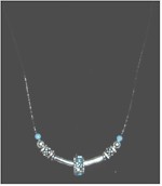 Aquamarine birthstones and silver necklace.