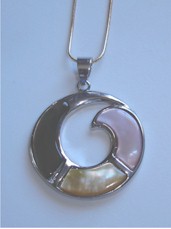 Pearly gray, pink and yellow shells set in circular metal pendant.