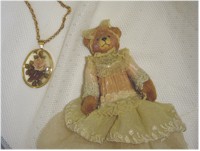 Vintage flower pendant necklace and lacy bear.