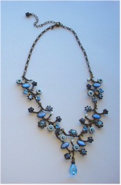 Vintage Avon blue flowers necklace of pearls, rhinestones on antique bronze.