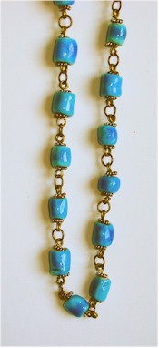 Vintage ocean blue ceramic porcelain beads on handwrought bronze chain links.