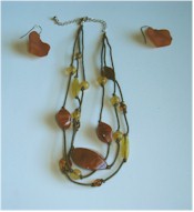 Vintage necklace of Carnelian and Amber stones on knotted cords, with matching earrings.