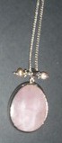 Rose Quartz oval pendant bezel set in silver, with pink Freshwater Pearls on silver necklace chain.